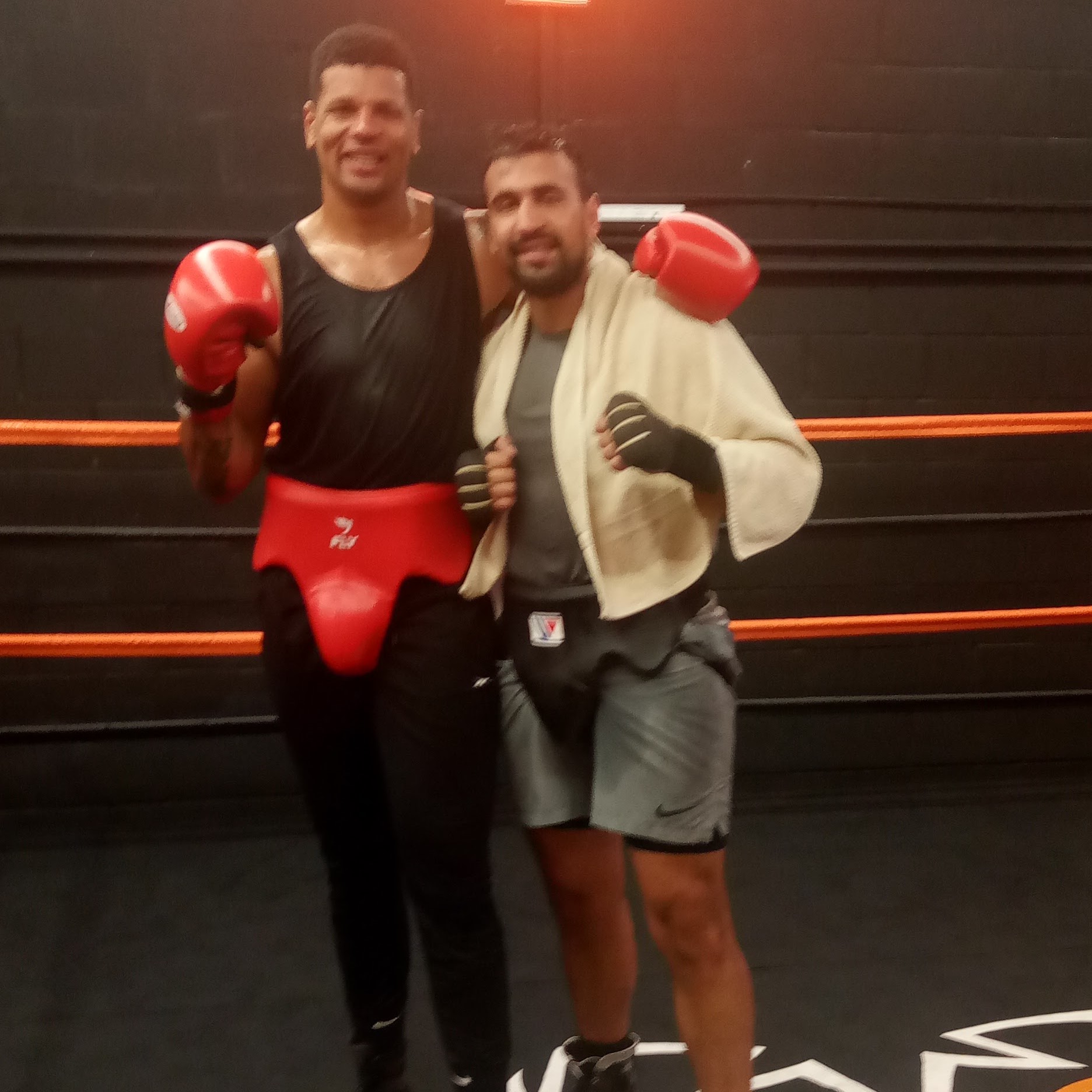 two boxers posing in the ring