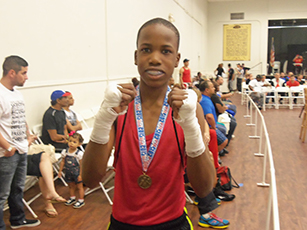 Boxer posing with medal